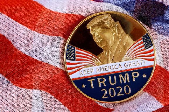 Donald Trump coin presidential against US flag in the election 2020