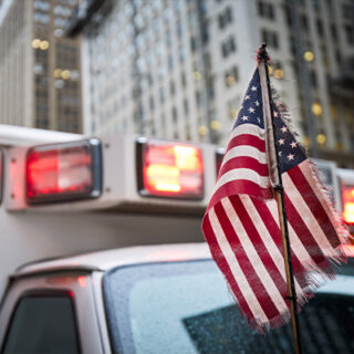 american-flag-on-ambulance-car-2023-11-27-05-32-13-utc