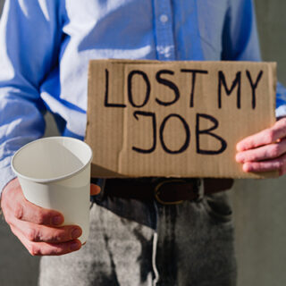 man-with-cardboard-sign-lost-job-2023-11-27-05-00-57-utc-square